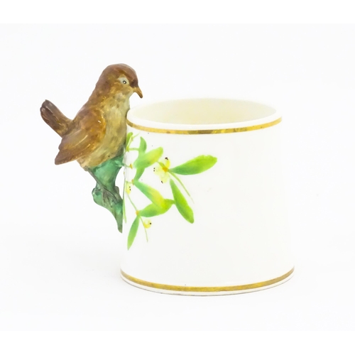 123 - A Victorian Copeland mug, the handle modelled as a wren / bird perched on a looped branch, the body ... 