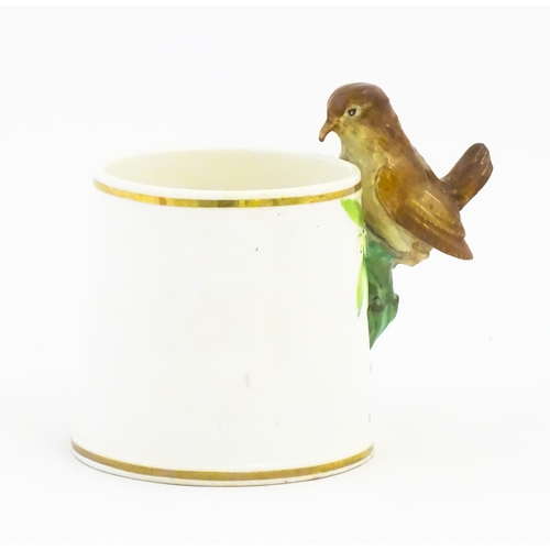 123 - A Victorian Copeland mug, the handle modelled as a wren / bird perched on a looped branch, the body ... 