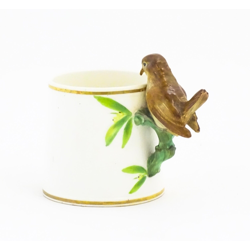 123 - A Victorian Copeland mug, the handle modelled as a wren / bird perched on a looped branch, the body ... 