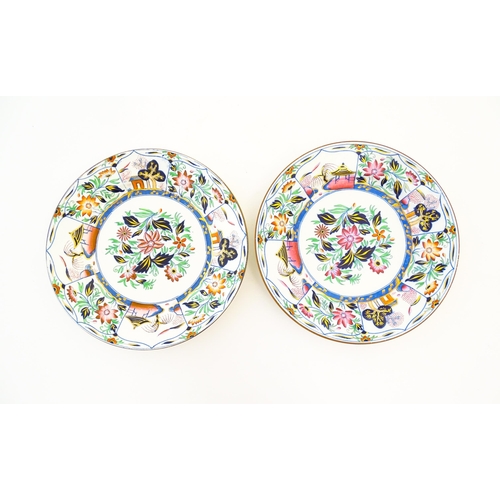 127 - A pair of 19thC Spode plates decorated with a central chinoiserie floral spray within a panelled bor... 