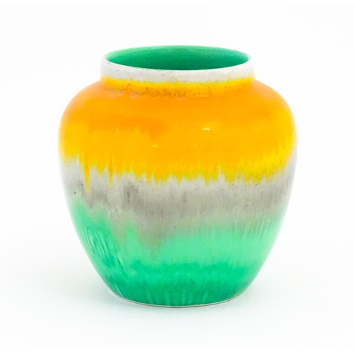 132 - A Shelley Art Deco vase / jar with a drip glaze in orange, grey and green. Marked under. Approx. 4 1... 