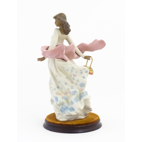 136 - A Lladro figure titled Spring Splendor, model no. 2325. With box and circular wooden stand. Approx. ... 