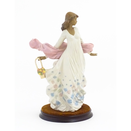 136 - A Lladro figure titled Spring Splendor, model no. 2325. With box and circular wooden stand. Approx. ... 