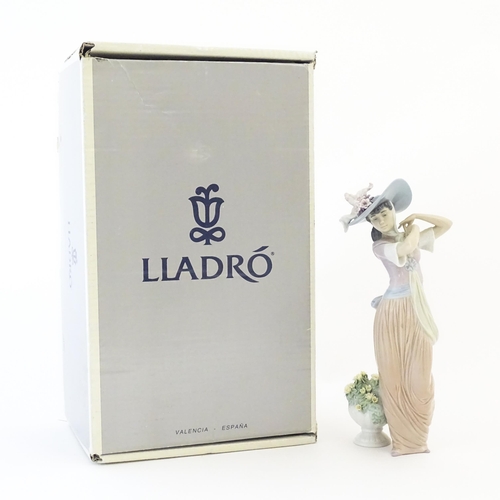 137 - A Lladro figure titled Paris in Bloom, model no. 6280. With box. Approx. 12