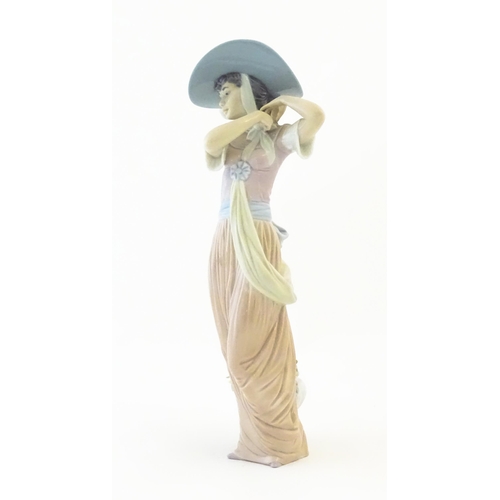 137 - A Lladro figure titled Paris in Bloom, model no. 6280. With box. Approx. 12