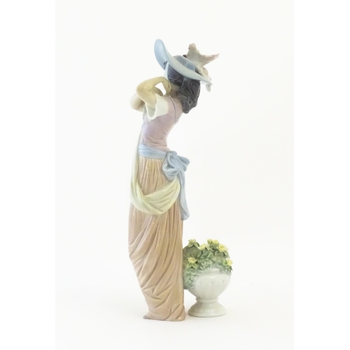 137 - A Lladro figure titled Paris in Bloom, model no. 6280. With box. Approx. 12