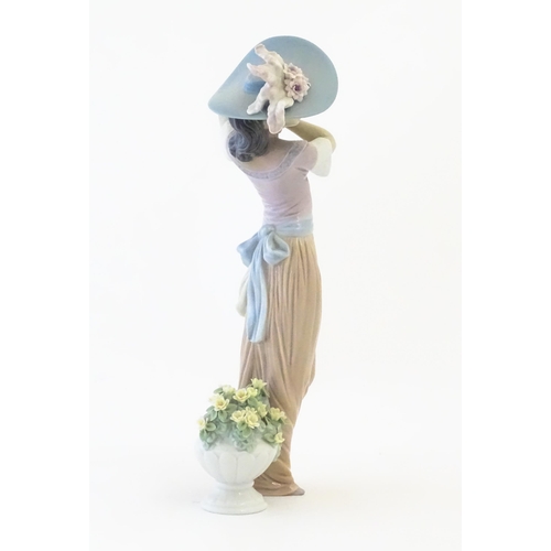 137 - A Lladro figure titled Paris in Bloom, model no. 6280. With box. Approx. 12