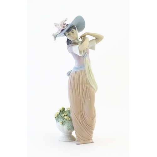 137 - A Lladro figure titled Paris in Bloom, model no. 6280. With box. Approx. 12