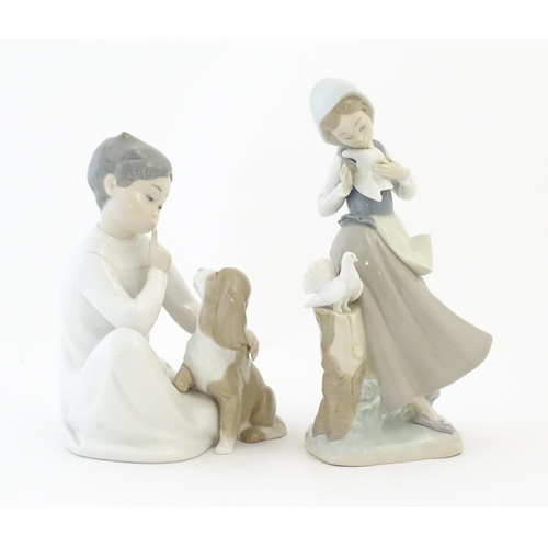 141 - Two Lladro figures comprising Girl with Doves model no. 4915 and Boy with Dog model no. 4522. Larges... 