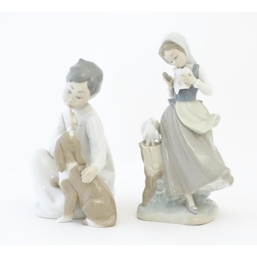 141 - Two Lladro figures comprising Girl with Doves model no. 4915 and Boy with Dog model no. 4522. Larges... 