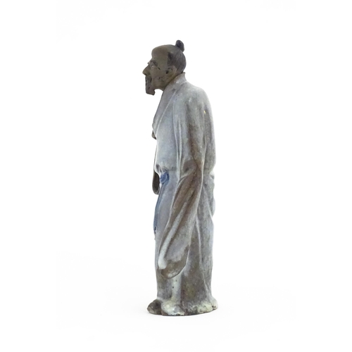 51 - A Chinese mud man figure depicted wearing robes. Approx. 7 1/4