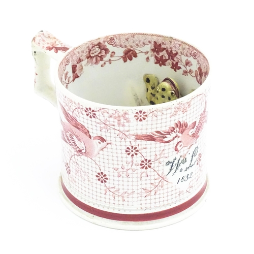52 - A 19thC frog mug, the exterior decorated with transfer printed birds, flowers and foliage, initialle... 