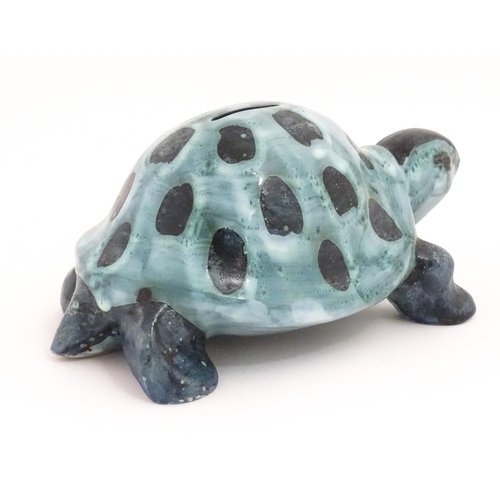 97 - A studio pottery money box modelled as a tortoise by David Sharp for Rye Pottery. Marked under. Appr... 