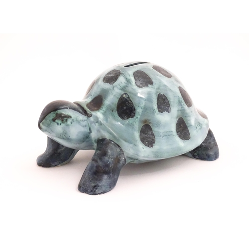 97 - A studio pottery money box modelled as a tortoise by David Sharp for Rye Pottery. Marked under. Appr... 