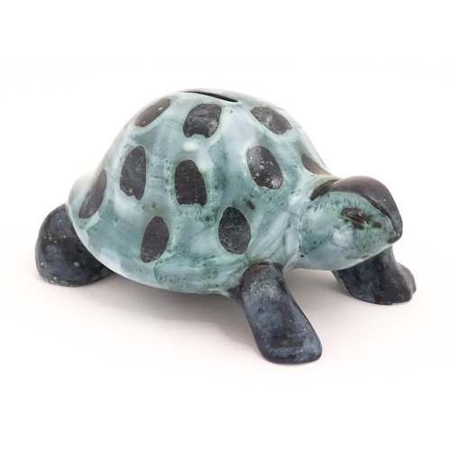 97 - A studio pottery money box modelled as a tortoise by David Sharp for Rye Pottery. Marked under. Appr... 