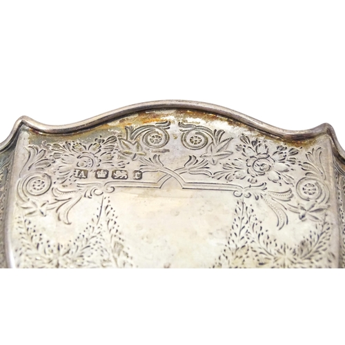 314 - A silver sugar basin with twin handles, engraved foliate detail and gilded interior. Hallmarked Shef... 