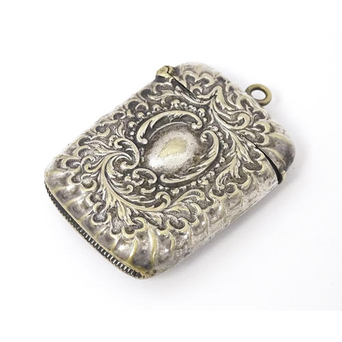 316 - A silver plate vesta case with embossed decoration. Approx. 2