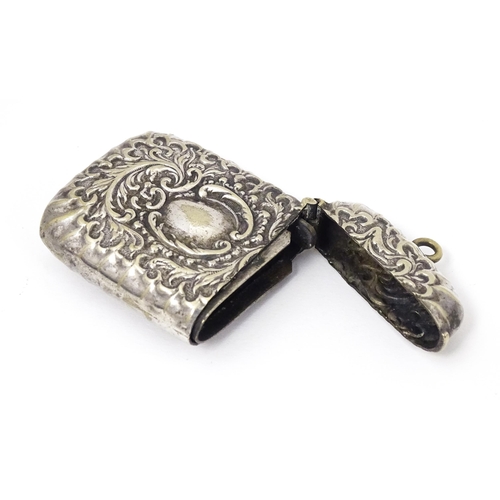 316 - A silver plate vesta case with embossed decoration. Approx. 2