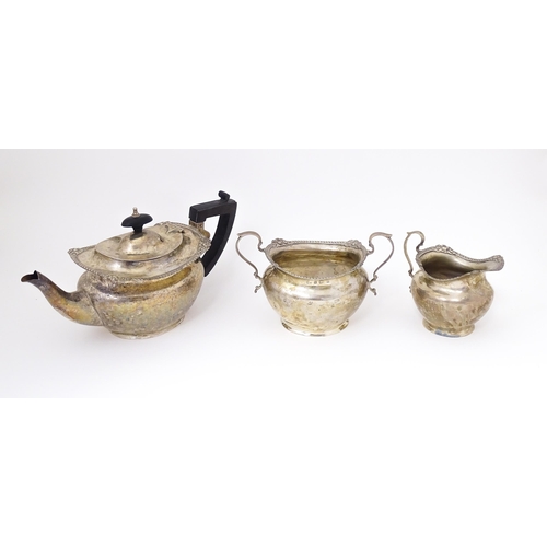 317 - A Victorian silver three piece tea set comprising teapot, milk jug and sugar basin. Hallmarked Birmi... 