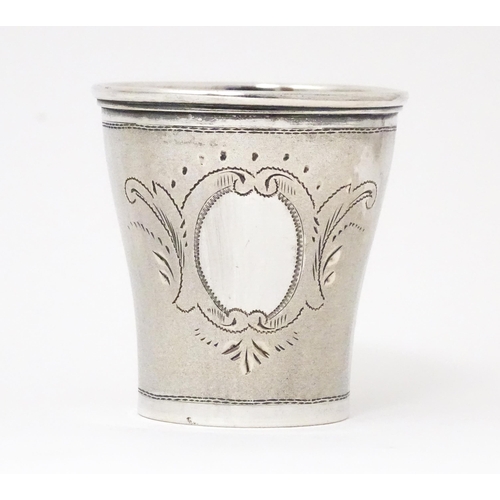 325 - A late 19thC / early 20thC  Austro Hungarian silver tot cup with engraved decoration. Marked under a... 