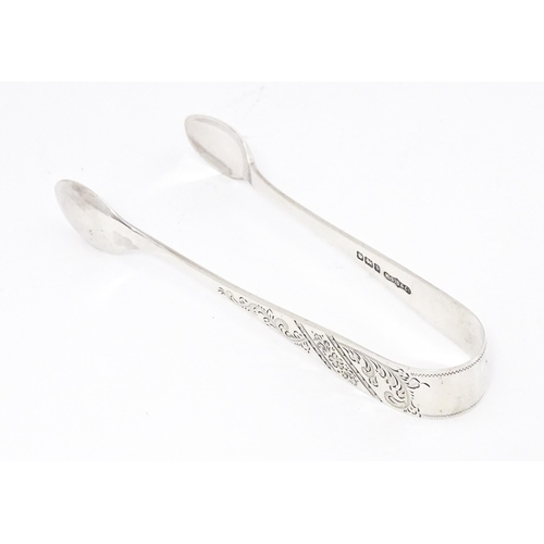 328 - Silver sugar tongs with engraved decoration, hallmarked Sheffield 1913 W S Savage & Co.  Approx. 4