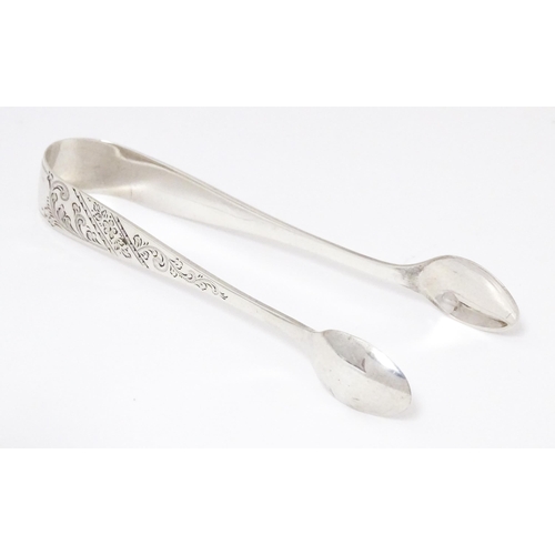 328 - Silver sugar tongs with engraved decoration, hallmarked Sheffield 1913 W S Savage & Co.  Approx. 4