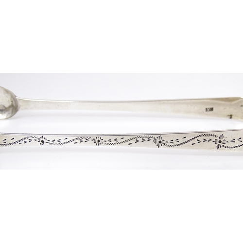 329 - Geo III silver sugar tongs with bright cut decoration, hallmarked London 1805, maker Stephen Adams. ... 