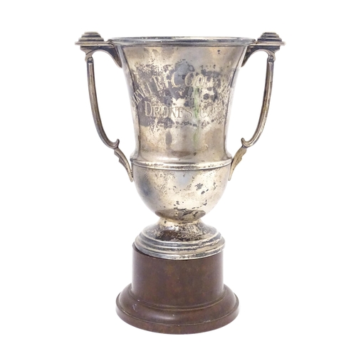 331 - An Art Deco silver trophy cup with twin handles. Hallmarked Birmingham 1937 maker A E Poston & Co Lt... 