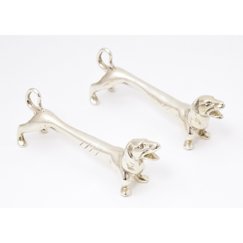 370 - A pair of novelty silver knife rests modelled as dachshund dogs, hallmarked Chester 1905, maker Chan... 