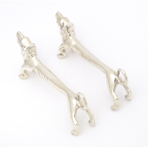 370 - A pair of novelty silver knife rests modelled as dachshund dogs, hallmarked Chester 1905, maker Chan... 