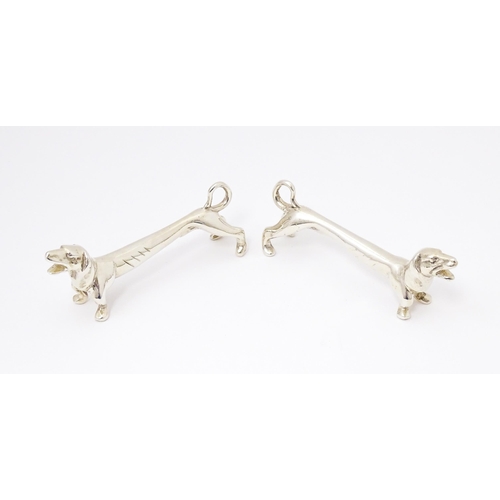 370 - A pair of novelty silver knife rests modelled as dachshund dogs, hallmarked Chester 1905, maker Chan... 