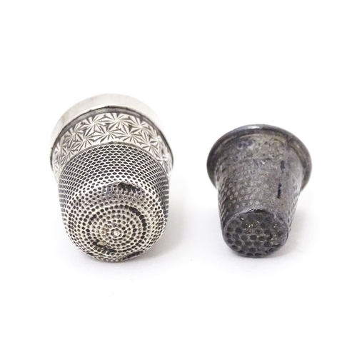 373 - Two white metal thimbles, one titled ' For a good girl  (2)