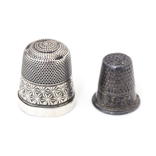 373 - Two white metal thimbles, one titled ' For a good girl  (2)