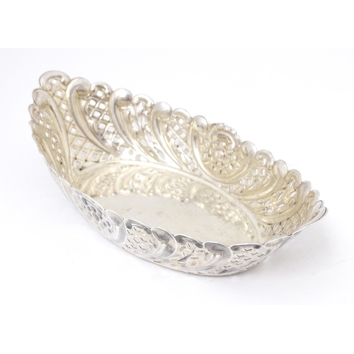 388 - A Victorian silver sweet meat dish of oval form with pierced and embossed decoration. hallmarked She... 