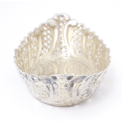 388 - A Victorian silver sweet meat dish of oval form with pierced and embossed decoration. hallmarked She... 