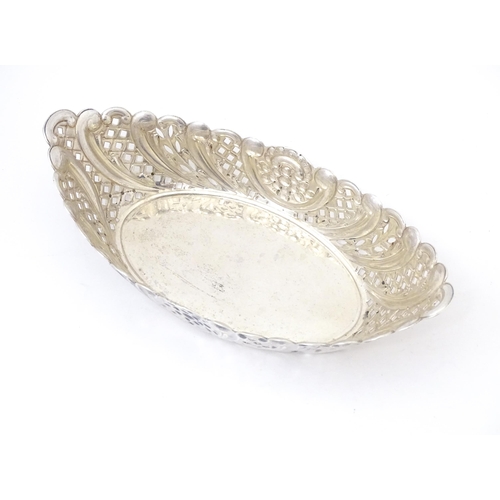 388 - A Victorian silver sweet meat dish of oval form with pierced and embossed decoration. hallmarked She... 