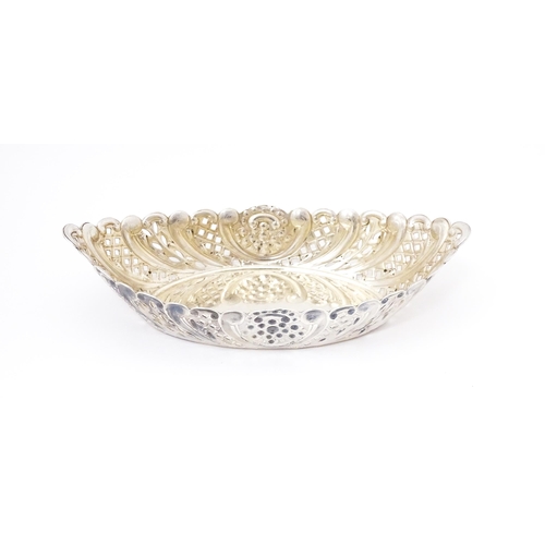 388 - A Victorian silver sweet meat dish of oval form with pierced and embossed decoration. hallmarked She... 