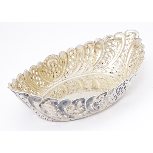 388 - A Victorian silver sweet meat dish of oval form with pierced and embossed decoration. hallmarked She... 