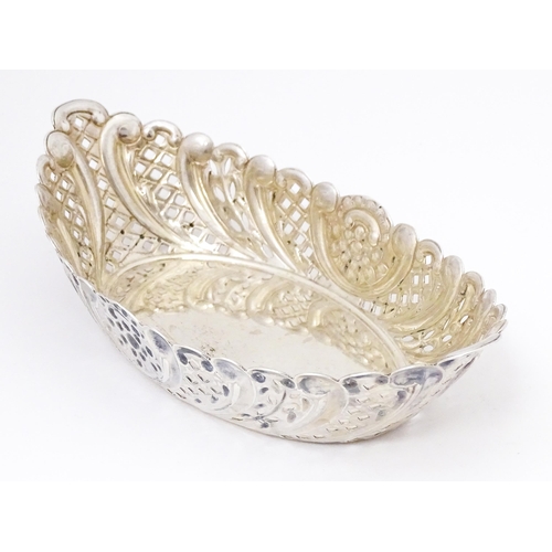 388 - A Victorian silver sweet meat dish of oval form with pierced and embossed decoration. hallmarked She... 