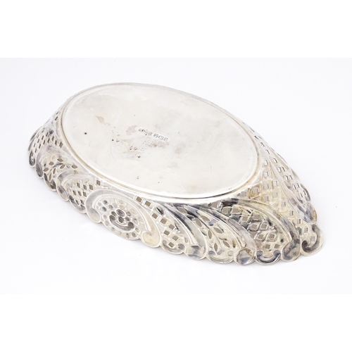 388 - A Victorian silver sweet meat dish of oval form with pierced and embossed decoration. hallmarked She... 