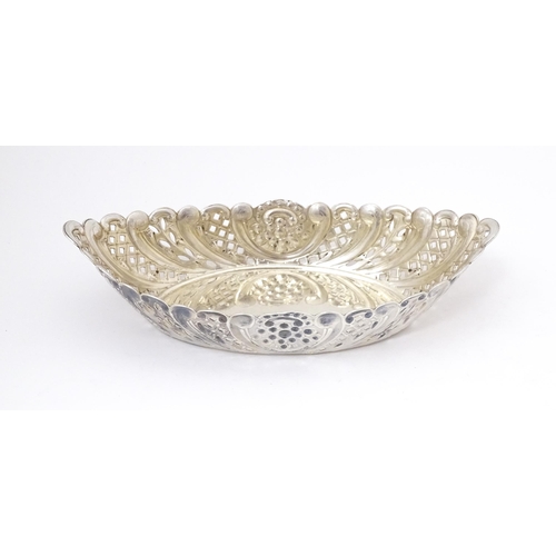 388 - A Victorian silver sweet meat dish of oval form with pierced and embossed decoration. hallmarked She... 