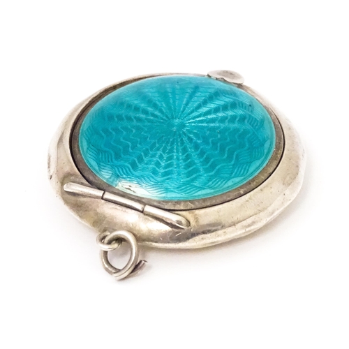 392 - An Art Deco silver small compact / pill box with turquoise guilloche enamel decoration, hallmarked B... 