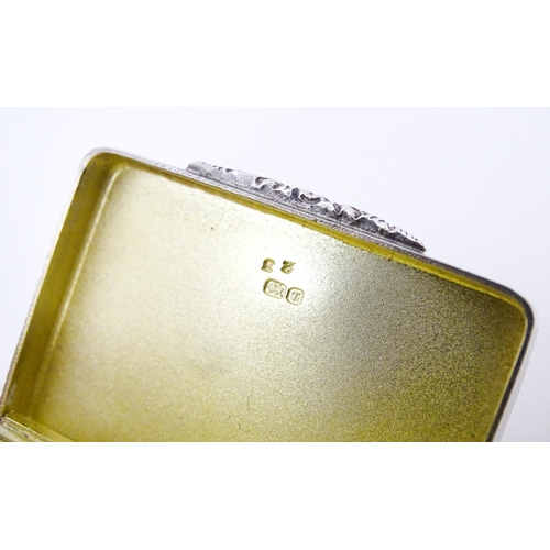 405 - A silver pill box with engine turned decoration and gilded interior, hallmarked Birmingham 1993 make... 