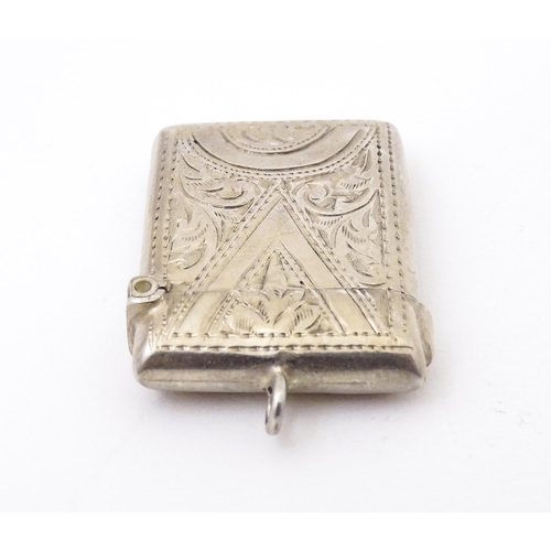 409 - A silver vesta with engraved decoration, hallmarked Birmingham 1903 maker Arthur Cook.  Approx. 1 1/... 