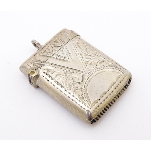 409 - A silver vesta with engraved decoration, hallmarked Birmingham 1903 maker Arthur Cook.  Approx. 1 1/... 