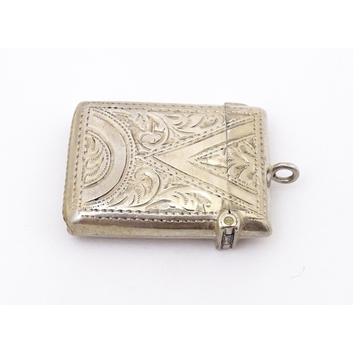 409 - A silver vesta with engraved decoration, hallmarked Birmingham 1903 maker Arthur Cook.  Approx. 1 1/... 