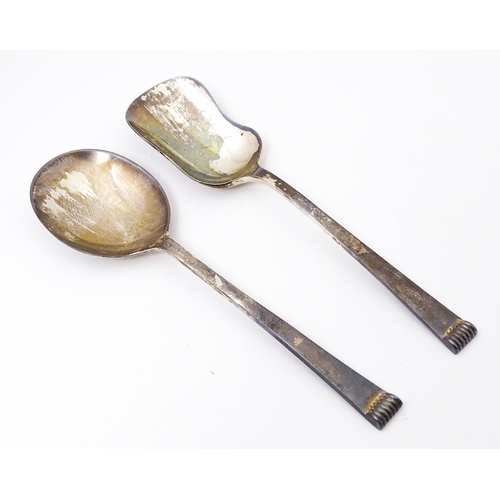 411 - Two cased silver spoons comprising a sugar spoon of shovel form and a preserve spoon. Hallmark Sheff... 