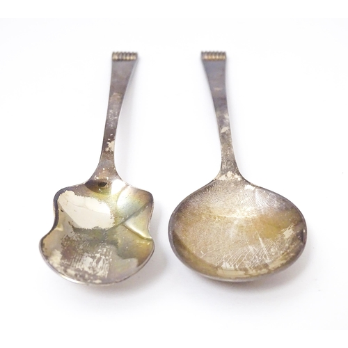 411 - Two cased silver spoons comprising a sugar spoon of shovel form and a preserve spoon. Hallmark Sheff... 