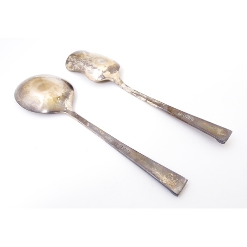 411 - Two cased silver spoons comprising a sugar spoon of shovel form and a preserve spoon. Hallmark Sheff... 