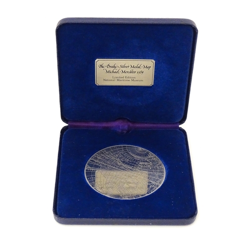 419 - A cased limited edition commemorative silver medallion titled 'The Drake Silver Medal Map, Michael M... 